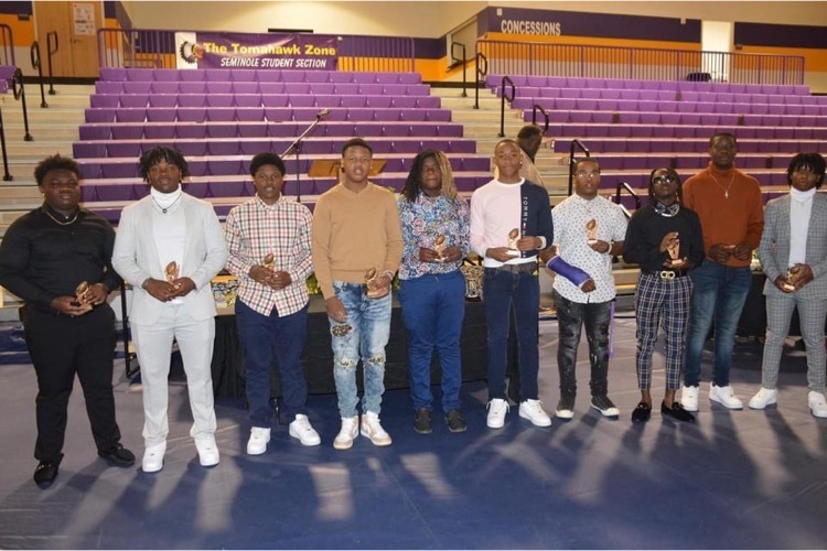 picture of athletes with awards