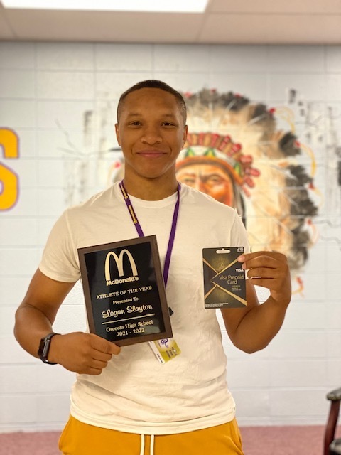 Picture of student with  award and  gift card