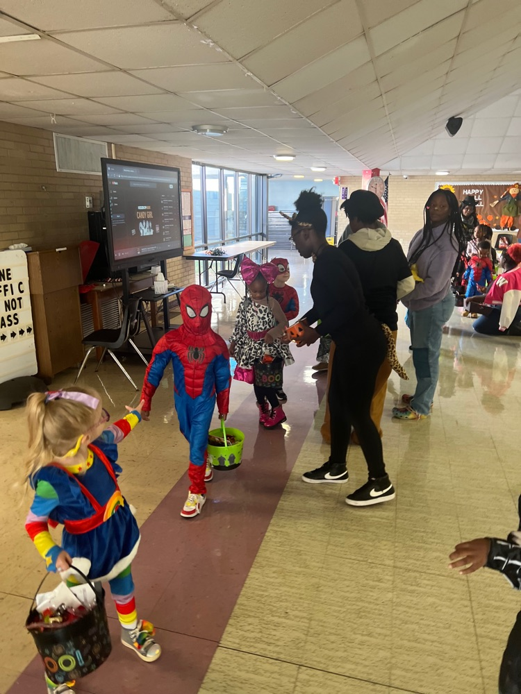 students passing out candy